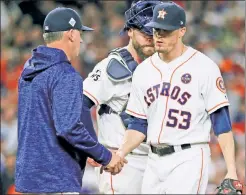  ??  ?? NO KEN DO: Manager A.J. Hinch takes the ball from closer Ken Giles, who continued a miserable World Series by being charged with three runs without getting an out in the Astros’ 6-2 Game 4 loss.