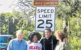  ?? COURTESY PHOTOS ?? Apopka Mayor Bryan Nelson, Wanda Lawson (Jerry’s daughter), Jerry Lawson and Julie Lawson (Jerry’s wife) stand below Jerry Lawson Way sign, dedicated in 2017.