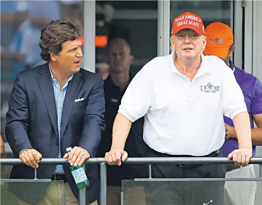  ?? ?? Donald Trump with Tucker Carlson at the former president’s Bedminster golf course last July. Left, Carlson ‘s Jan 6 coverage