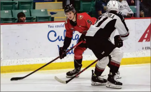  ?? CITIZEN PHOTO BY JAMES DOYLE ?? Prince George Cougars forward Aiden Reeves looks to make a move with the puck against Vancouver Giants defender Nicco Camazzola in a game Feb. 12 at CN Centre.