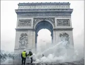  ??  ?? The Arc de Triomphe in Paris came under attatck from the rioters