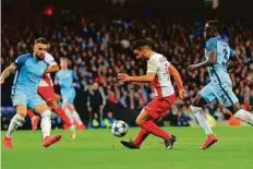  ?? Reuters ?? Monaco’s Radamel Falcao scores his side’s third against Man City with a delightful chip. However, City prevailed 5-3.