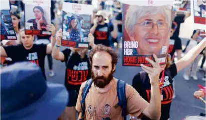  ?? WASHINGTON POST/FILE ?? The image of Vivian Silver was featured on posters and fliers during demonstrat­ions in support of those believed to be kidnapped and taken to the Gaza Strip.