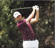  ?? Kevin C. Cox / Getty Images ?? Patrick Cantlay plays his shot from the second tee during the first round of the Tour Championsh­ip on Thursday in Atlanta.