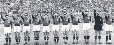  ?? AFP ?? Offensive line: the Italian team’s fascist salute, led by captain Giuseppe Meazza (right)