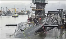  ??  ?? FLEET: HMS Vigilant, one of the Trident submarines docked at Faslane