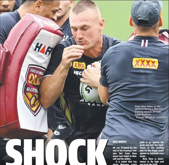  ?? Picture: BRADLER KANARIS ?? Coen Hess takes on the defence during a Maroons training, session at Cbus Super Stadium.