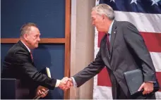  ?? MICKEY WELSH, MONTGOMERY ADVERTISER ?? Roy Moore and Luther Strange shake hands after debating for the Republican nomination for the U.S. Senate seat on Thursday in Montgomery, Ala.