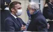  ?? MICHEL EULER — THE ASSOCIATED PRESS FILE ?? France’s President Emmanuel Macron, left, welcomes OECD’s Secretary General Angel Gurria for a working lunch at the Elysee Palace in Paris on Dec. 14.