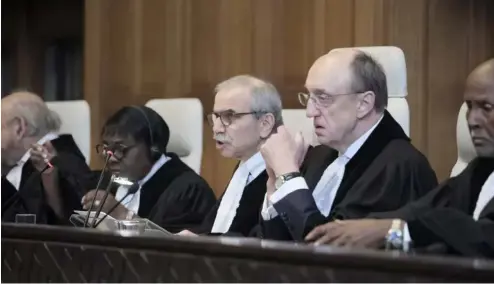  ?? ?? Judge Nawaf Salam, center, speaks at the start of a two days hearing at the World Court in The Hague, Netherland­s, Monday, April 8, 2024.