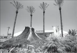  ?? Bob Chamberlin Los Angeles Times ?? AN ARTIFICIAL lava f low streams down the side of a miniature volcano outside a 60,000-square-foot tent that housed the Hawaiian Gardens Casino in 2000.