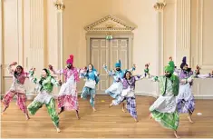  ??  ?? Bhangra dancers in one of Martin Parr’s idents for BBC One, left, and a St George’s Day parade in West Bromwich, below