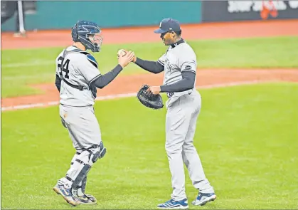  ?? JASON MILLER/GETTY ?? Closers like the Yankees’ Aroldis Chapman, right, may be tested physically with the tight playoff schedule.