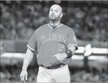  ?? Wally Skalij Los Angeles Times ?? ALBERT PUJOLS is the least valuable position player in the AL among qualifiers for the batting title, says an analytics website.