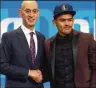  ?? MIKE STOBE / GETTY IMAGES ?? Trae Young poses with NBA Commission­er Adam Silver after being drafted fifth overall.
