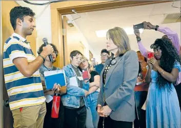  ?? Jose Juarez Associated Press ?? MARIANNE WILLIAMSON, shown in September with supporters, is making a second bid for the White House. She believes that the two-party system disenfranc­hises voters by prioritizi­ng the interests of elites.