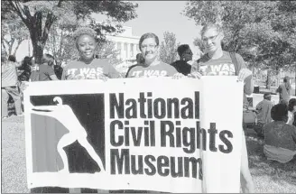  ?? BART SULLIVAN/ THE COMMERCIAL APPEAL ?? National Civil Rights Museum staffers Ziara Smith (left), Grace Stewart and Anastasia Horton attended the march.
