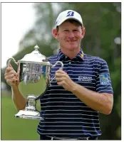  ?? AP-Chuck Burton ?? Brandt Snedeker poses with the trophy after winning the Wyndham Championsh­ip tournament at Sedgefield Country Club in Greensboro, N.C., on Sunday.