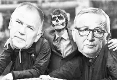  ??  ?? Activists acting as European Commission president Jean-Claude Juncker (right), EU commission­er in charge of Health and Food SafetyVyte­nisAndriuk­aitis (left) and Monsantoch­aracters with their faces painted with a skull enact a tug-of-war against EU...