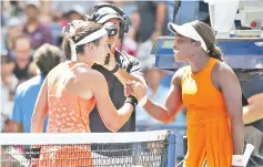  ??  ?? Anastasija Sevastova of Latvia (left) greets Sloane Stephens of the US their quarter-final match. — USA TODAY Sports photo