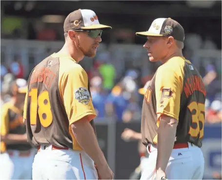  ?? SEAN M. HAFFEY, GETTY IMAGES ?? The Cubs’ Ben Zobrist and the Pirates’ Mark Melancon likely won’t be friendly beyond the All-Star Game.