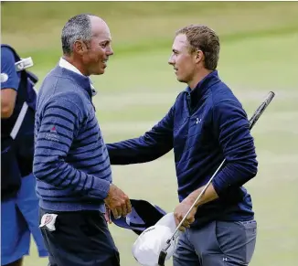  ?? PETER MORRISON / ASSOCIATED PRESS ?? Jordan Spieth (right) is congratula­ted by runner-up Matt Kuchar, a former Georgia Tech star, after completing his three-shot British Open victory at Royal Birkdale.