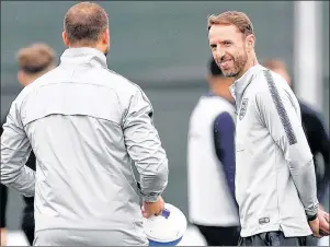  ?? AP PHOTO ?? England’s head coach Gareth Southgate watches his players take part in a training session Tuesday in Zelenogors­k, near St. Petersburg, Russia.