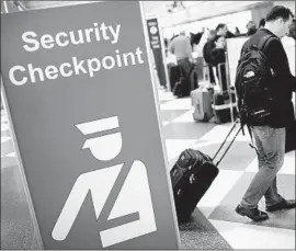  ?? Scott Olson Getty Images ?? THE PROPOSAL for ending passenger screenings at airports serving planes with 60 or fewer seats was only part of a budget exercise, a TSA spokesman said.