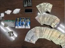  ?? PHOTO COURTESY OF EXETER POLICE ?? Police seized over $10,000 in cash and over $11,000 worth of drugs during a traffic stop in Exeter Thursday evening.