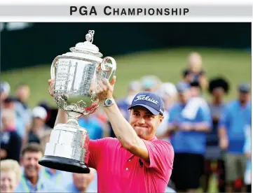  ?? AP PHOTO BY CHRIS O’MEARA ?? Justin Thomas poses with the Wanamaker Trophy after winning the PGA Championsh­ip golf tournament at the Quail Hollow Club Sunday, in Charlotte, N.C.