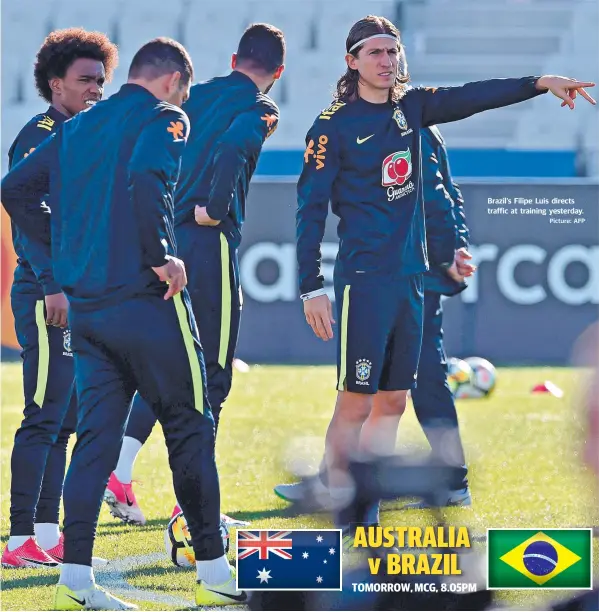  ?? Picture: AFP ?? Brazil’s Filipe Luis directs traffic at training yesterday.