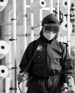  ?? AP ?? An employee of Songyo Knitwear Factory in Songyo district disinfects the work floor in Pyongyang, North Korea, Wednesday, after the country’s leader Kim Jong Un said Tuesday his party would treat the country’s coronaviru­s outbreak under the state emergency.