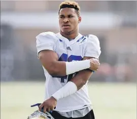  ?? Luis Sinco Los Angeles Times ?? UCLA LINEBACKER Kenny Young says being able to focus only on football helps the Bruins early in season. The will have played three games before classes start.