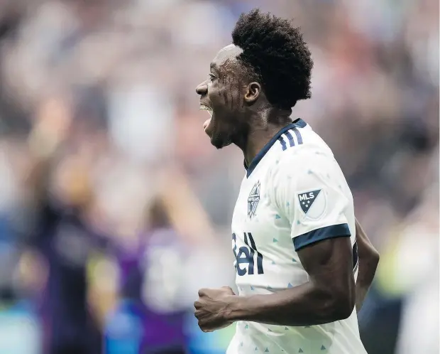  ?? — THE CANADIAN PRESS FILES ?? Alphonso Davies of the Whitecaps celebrates after scoring on Orlando City during the second half of Vancouver’s 5-2 win on Saturday night at B.C. Place. Davies’ goal in the 76th minute broke a 1-1 deadlock and brought the sagging home crowd back to life.
