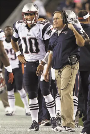  ?? Boston Globe via Getty Images ?? Jimmy Garoppolo played for Bill Belichick’s Patriots — until he was traded to the 49ers.