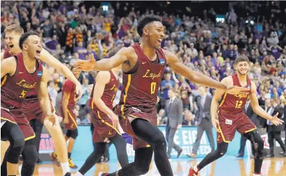  ?? DAVID GOLDMAN/ASSOCIATED PRESS ?? Loyola-Chicago players run on the court after winning Saturday’s South Regional final in Atlanta over No. 9 seed Kansas State, 78-62. The 11th-seeded Ramblers advance to next week’s Final Four in San Antonio, Texas.
