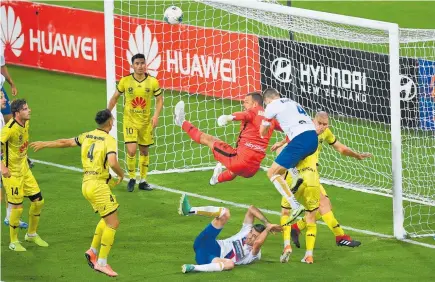  ?? Photo / Photosport ?? Stefan Marinovic was busy in the dying minutes as the Wellington Phoenix struggled to hold out the Newcastle Jets last night.