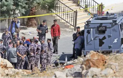  ?? Picture: AFP ?? CRIME SCENE. Jordanian security forces gather during a raid in the city of Salt, northwest of the capital Amman, yesterday. They killed three ‘terrorists’ and arrested five others during the raid.