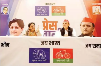  ?? Reuters ?? The Bahujan Samaj Party (BSP) chief Mayawati (left) speaks as Akhilesh Yadav, chief of Samajwadi Party (SP), looks on during a joint news conference to announce their alliance for the upcoming national election in Lucknow, India, on Saturday.