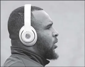  ??  ?? Photo shows a man wearing a Beats headphones.