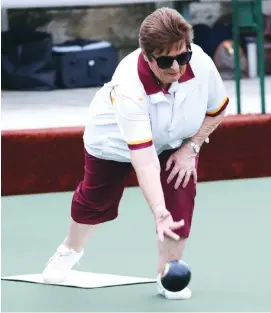  ??  ?? Above: Drouin third Margie Rhodes prepares to bowl against Morwell in division three on Tuesday. Margie’s team won “best rink winners” of the day with 24 shots up. Left: Drouin lead Trish Cole bowls on Tuesday in division three. Trish’s rink had a huge 39/15 win over Morwell to help Drouin to an overall 80/51 win. Drouin now sit just one position outside the “top four”.