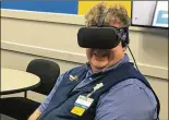  ?? HOLLY SHIVELY/ ?? Walmart uses virtual reality to train managers like John Philippo, who is learning how to handle high-stress situations during shopping holidays such as Black Friday.