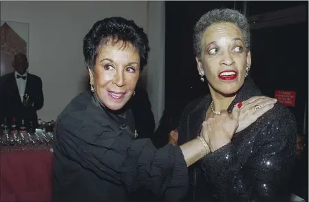  ?? BILL CUNNINGHAM — THE NEW YORK TIMES FILE ?? From left, Julie Robinson Belafonte and Johnnetta Cole, an anthropolo­gist, educator, and museum director, at an awards dinner at the Schomburg Center for Research in Black Culture in Harlem, New York, on Jan. 23, 2001.