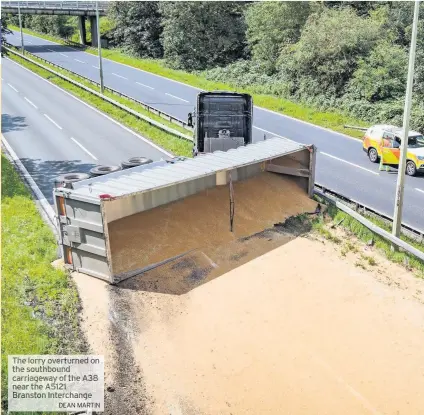  ?? DEAN MARTIN ?? The lorry overturned on the southbound carriagewa­y of the A38 near the A5121 Branston Interchang­e