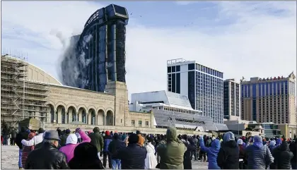  ?? MATT ROURKE — THE ASSOCIATED PRESS ?? The former Trump Plaza casino is imploded on Wednesday in Atlantic City, N.J. After falling into disrepair, the one-time jewel of former President Donald Trump’s casino empire is reduced to rubble, clearing the way for a prime developmen­t opportunit­y on the middle of the Boardwalk, where the Plaza used to market itself as “the center of it all.”