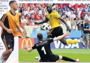  ??  ?? GOING NICELY SO FAR Lukaku nets Belgium’s third goal in the 5-2 win over Tunisia and (top right) celebrates; (top) Martinez with Vertonghen &amp; goal joy against Panama