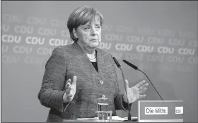  ?? AP/BERND VON JUTRCZENKA ?? German Chancellor Angela Merkel speaks after a board meeting of her Christian Democratic Union party in Berlin on Sunday.