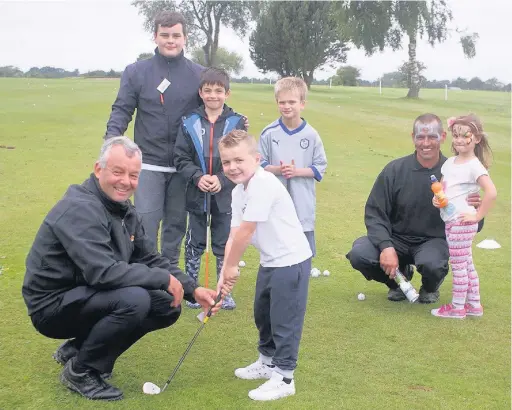  ??  ?? ●●Youngsters enjoy the golfing activities at Avro Golf Club’s fun day