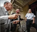  ?? THOMAS CORDY / THE PALM BEACH POST ?? Jim Johnson, left, a retired cop who headed a Huntington, W.Va., drug control agency, discusses the city’s heroin problem in 2016 with area officials.