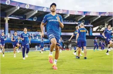  ??  ?? ↑
Mumbai Indian players attend a training session on Friday.